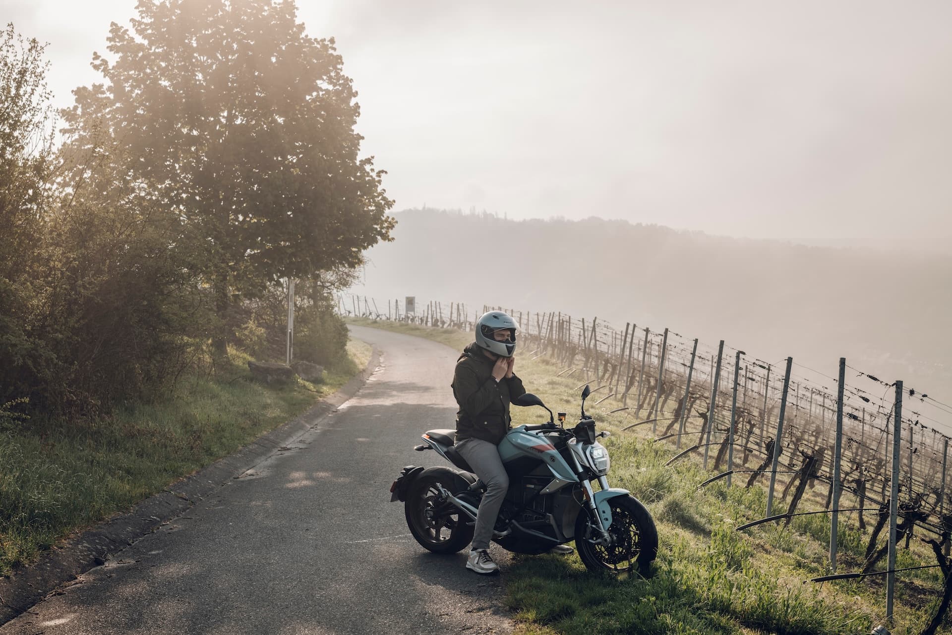 Man with helmet on a electrical motorcycle
