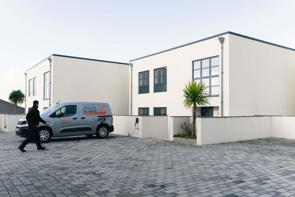 Easee EV charger installed on a concrete building in Cornwall