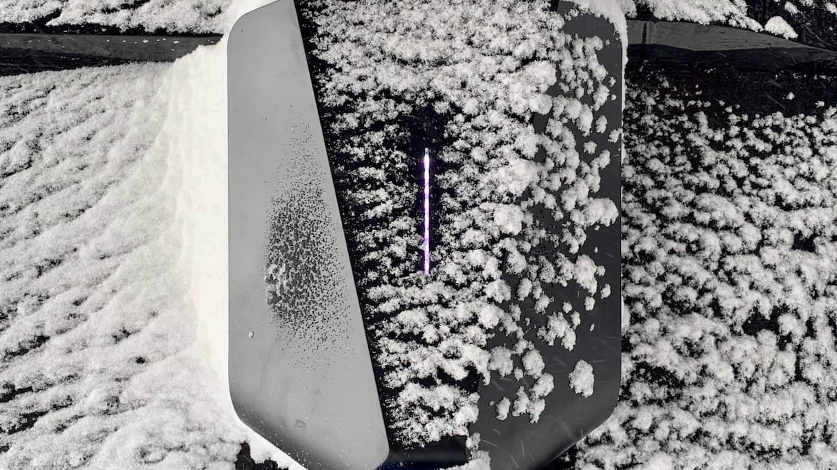 An EV charger covered in snow