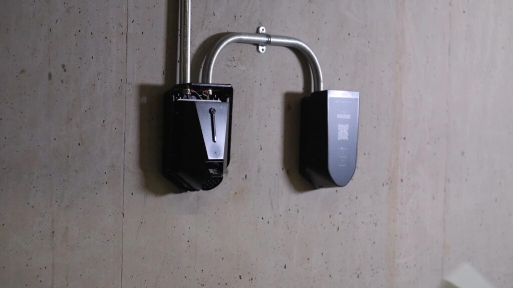 One charger without cover mounted besides an Easee Ready