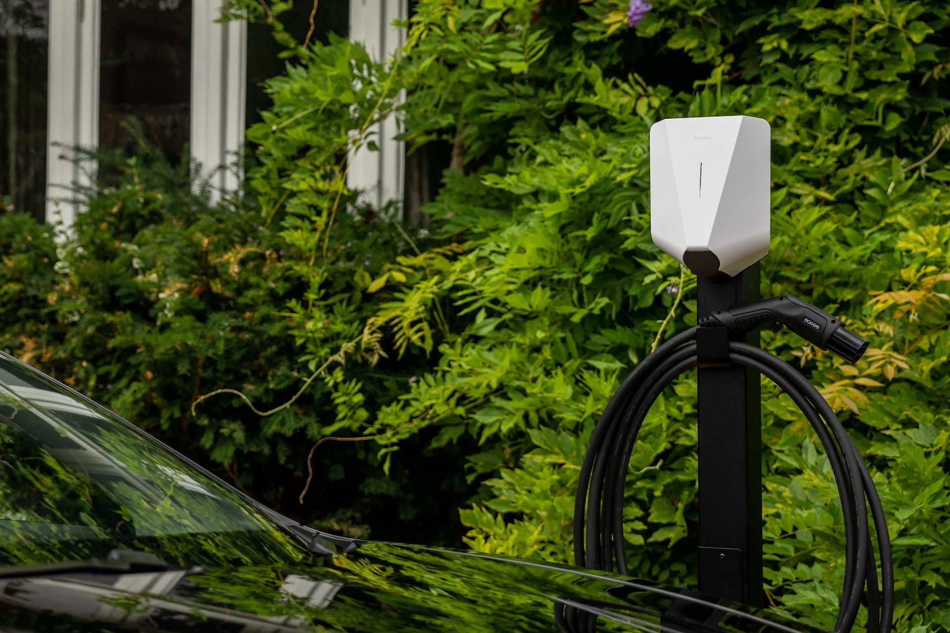 White electric car charger mounted on an Easee Base