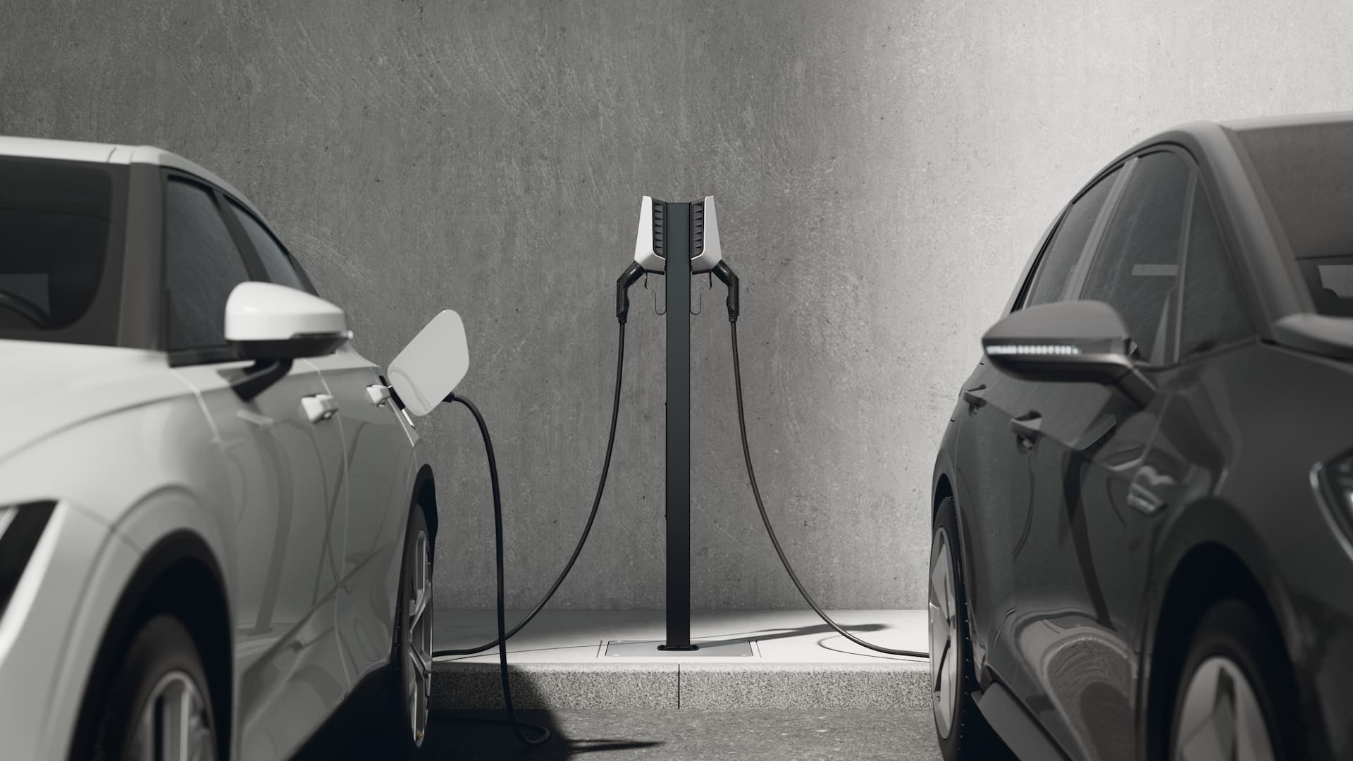 White and black electric cars charging side by side with two white chargers on a Base