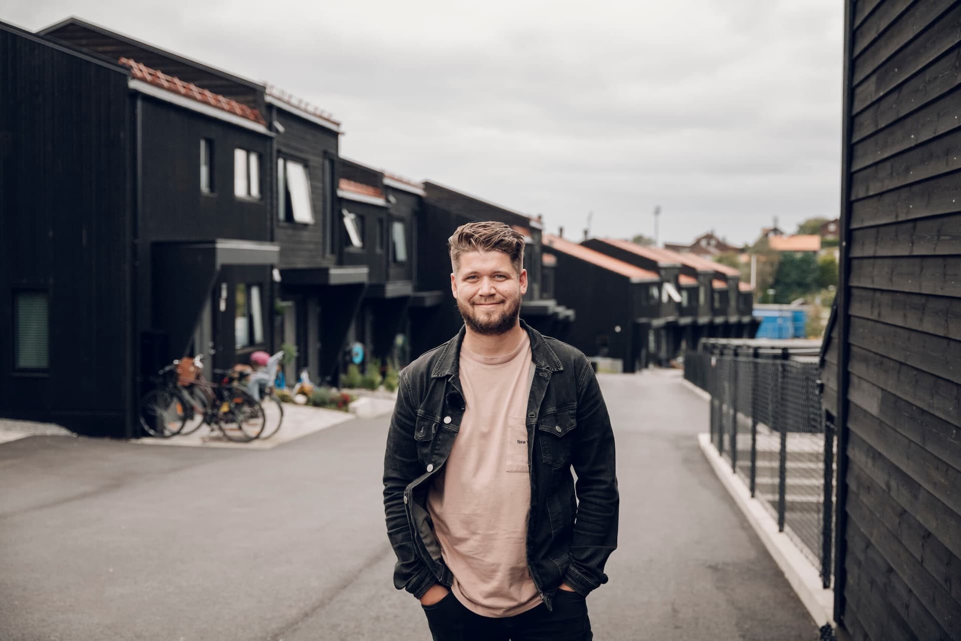 Man standing in the street of a MDU