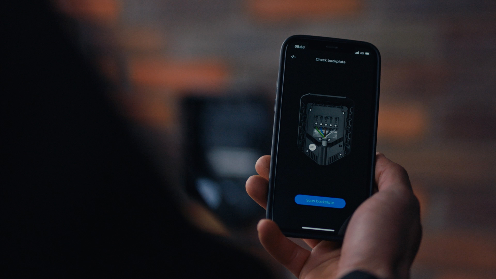 An installer using the installer app, which is ready to scan the backplate